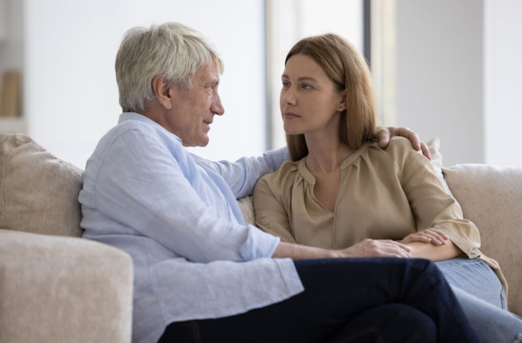 An adult child utilizes empathetic strategies to engage their older parent in a calm conversation