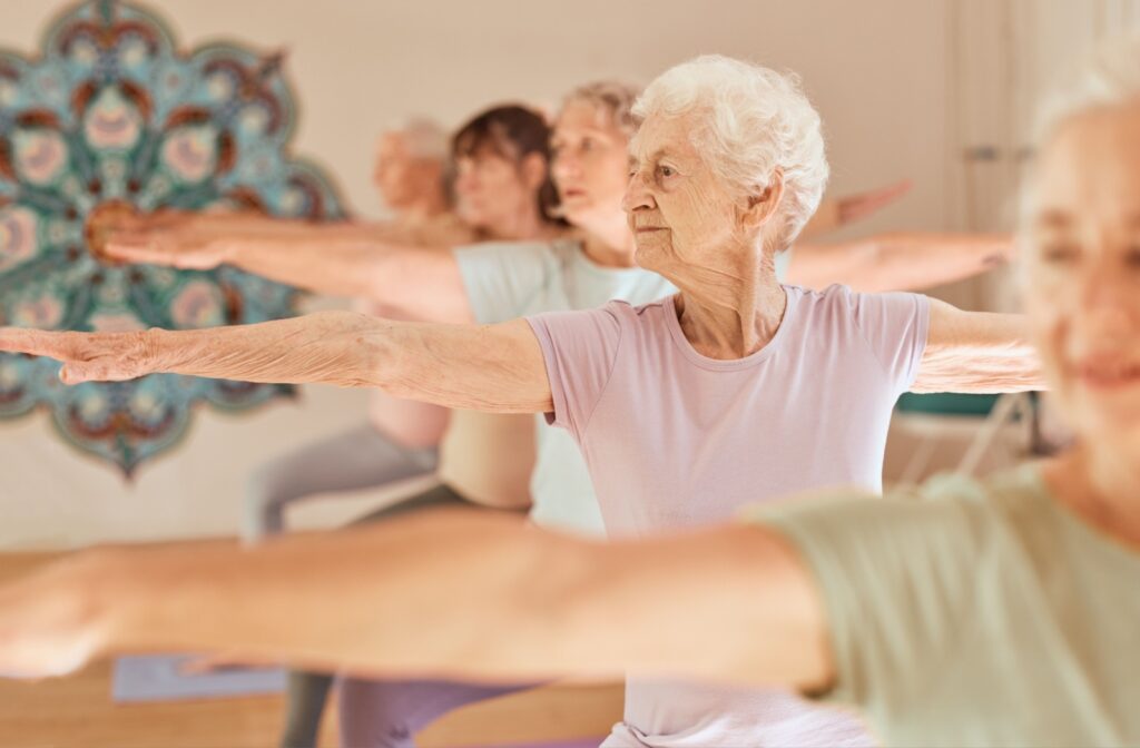 a group of seniors doing yoga.